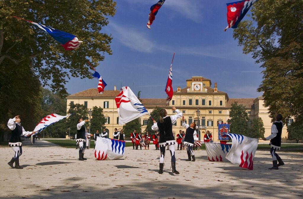 parma, italy, landscape, boys, nature, girls, twirling, flags, buildings, sky, clouds, entertainment, performing