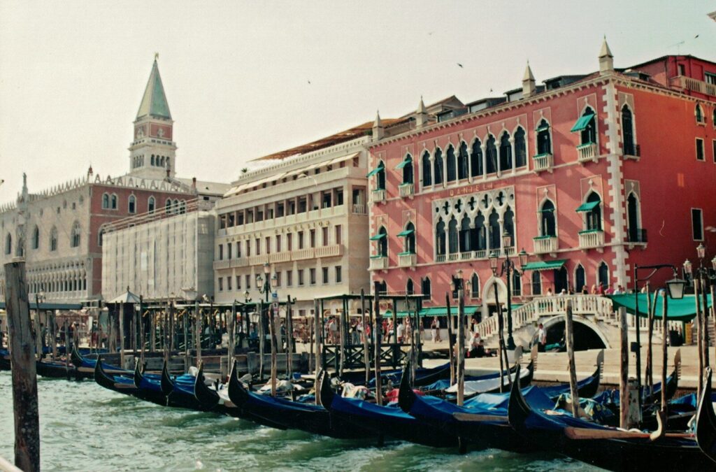 a canal with boats in it and buildings around it