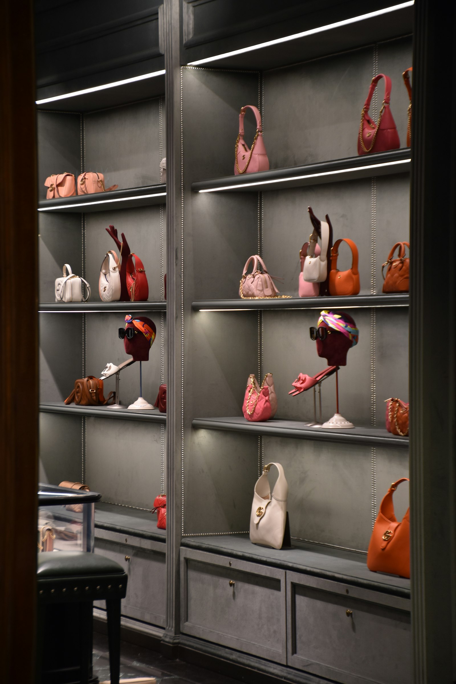Designer handbag display inside a Milan flagship boutique