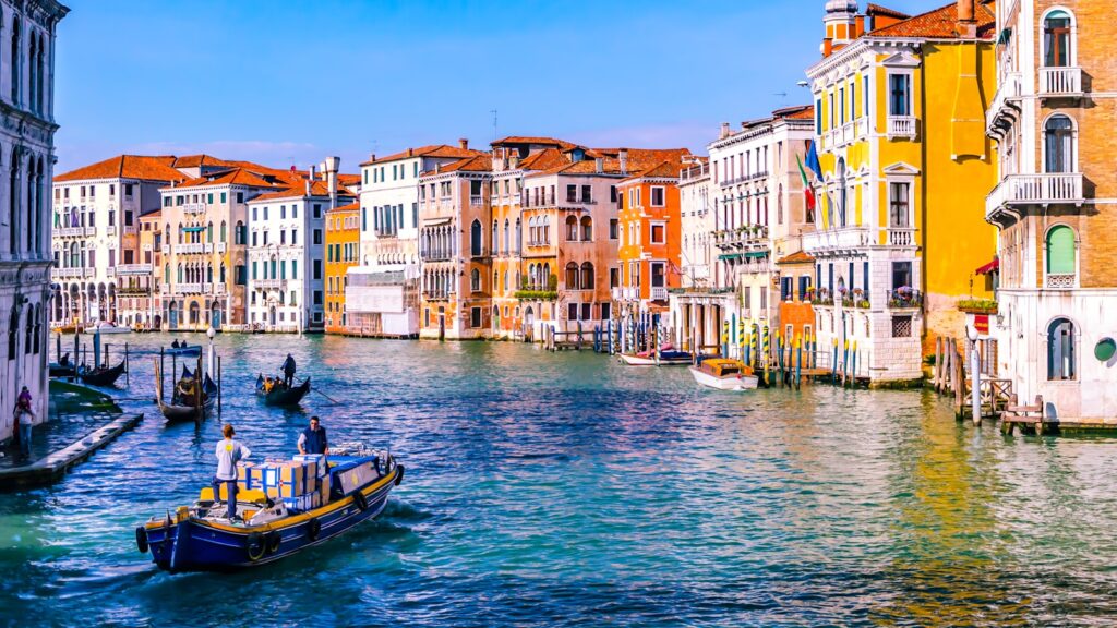 Venetian canal lined with historic buildings in late spring